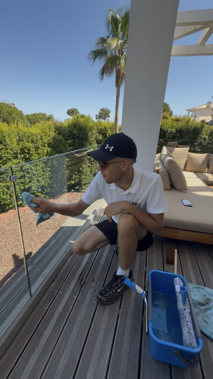 Detailing a glass balustrade on the terrace of a villa in Quinta do Lago