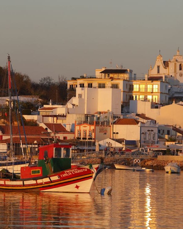 Fishing boats in front of Alvor village at sunset, Algarve