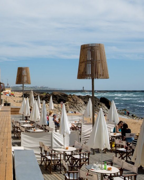 Seafront terrace looking along the beach at Praia da Luz, Algarve
