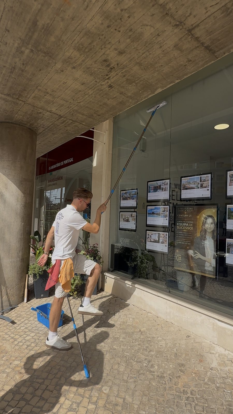 Arcade glazing Commercial window cleaning under the arcade at Vilamoura Marina, Algarve
