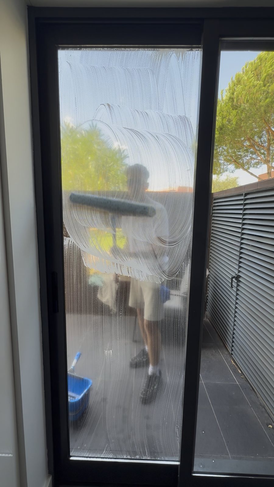 Inside glass cleaning looking out onto the terrace of an apartment in Vilamoura