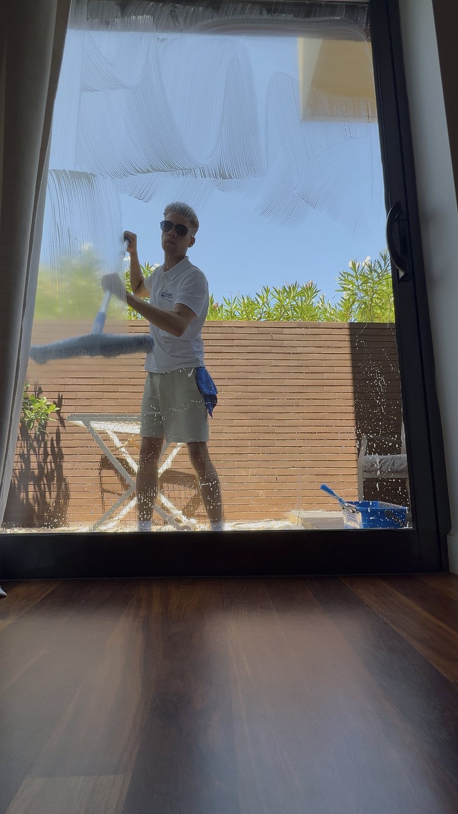 Inside window cleaning on the sliding patio doors of a Vilamoura apartment