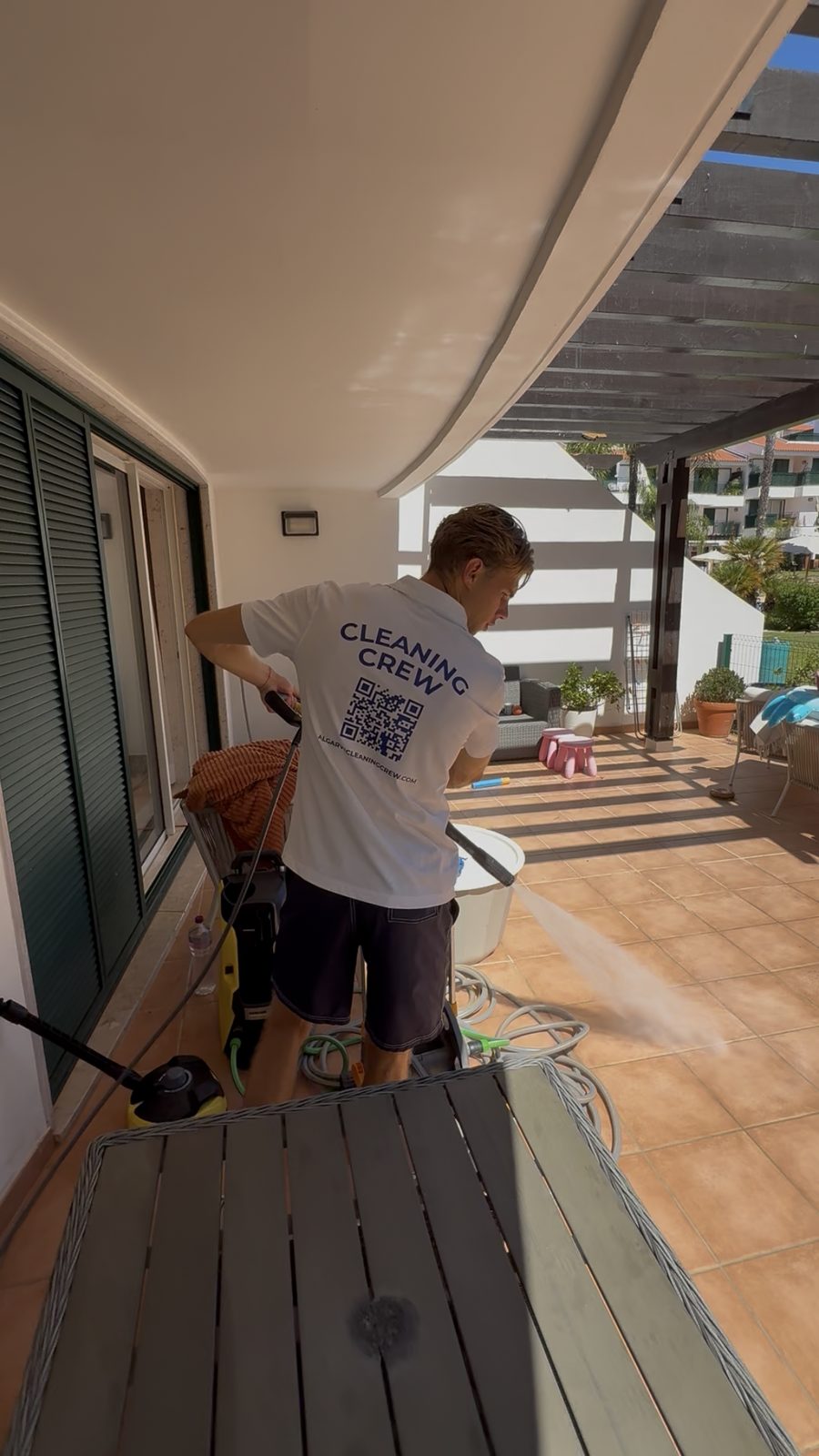 Pressure washing the terrace decking at an apartment in Vilamoura