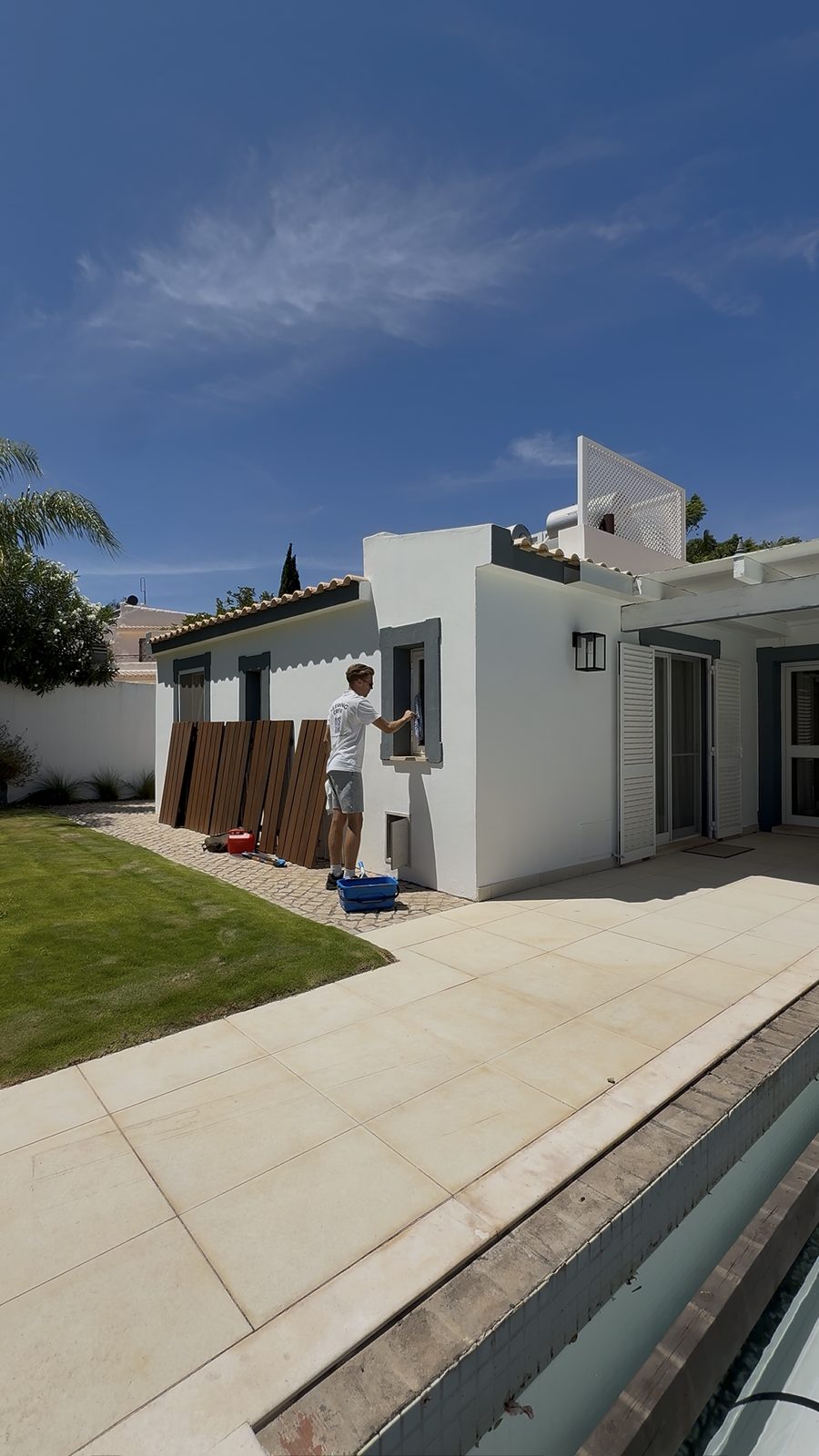 The exterior and pool terrace of a villa in Quinta do Lago